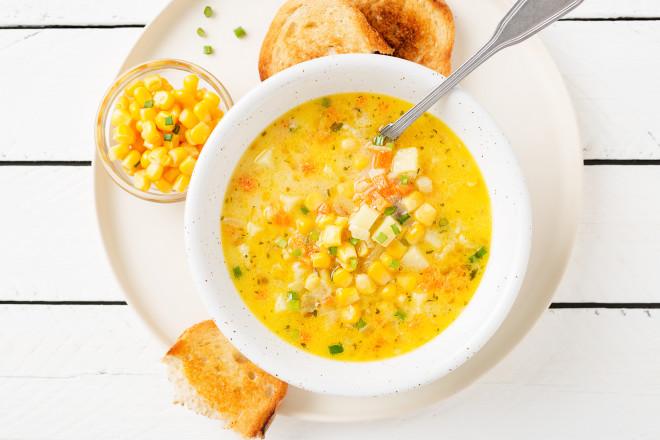 Creamy corn soup with vegetables and meat.