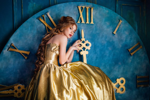 Beautiful woman in a golden ball gown in the great blue interior