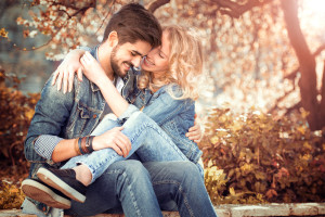 Couple in nature.Happy couple fall in love under a beautiful cherry tree.