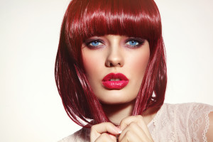 Beautiful fashion redhead girl with bob haircut and stylish make-up