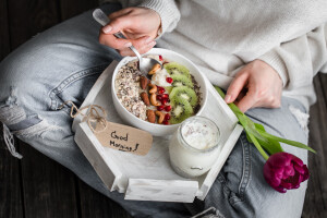 healthy breakfast at the girl in hands, concept of healthy food