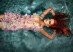 portrait of beautiful red-haired girl in the water