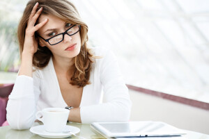 photo of beautiful woman sitting in a coffee house